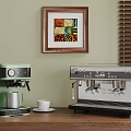 Stylish Green and Silver Coffee Appliances on Wooden Kitchen Counter with Cup and Frother