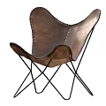 Brown Leather Armchair With Stitched Details And Black Metal Cross Legs