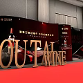 Elegant Banquet Hall Setup With Long Dining Tables Black Chairs And Red Stage Lighting