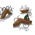 Triangular Wooden Bike Racks With Bicycles And Person Sitting Nearby