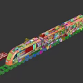 Colorful Model Train With Orange Front Multiple Carriages And Detailed Patterns On Railway Track