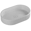 White Oval Shaped Washbasin With Vertical Ribbed Edges For Modern Bathroom Design