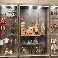 Dolls and Action Figures Collection Showcase in Glass Display Cabinets with Models