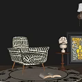 Black White Striped Accent Chair With Metal Legs Round Rug Floor Lamp And Decorative Artwork