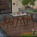 Outdoor Table with Marble Top and Two Wooden Chairs in Garden with Flowers