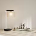 Modern Black Pole Desk Lamp with Light Square Shade on Desk with Books Metal Decor
