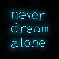 Stylish Blue Neon Decorative Light Displaying Never Dream Alone Against Black Background