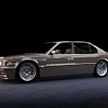 Silver Sedan Car with Classic Design and Alloy Wheels on Dark Background