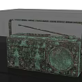Bronze Radio Shaped Sculpture With Intricate Carving Details In Display Case