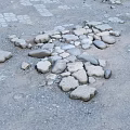 Gray Ground Surface With Scattered Stones And Small Gravel Pieces
