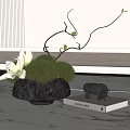 Elegant Black Vase With White Flowers Green Moss Balls And Twigs On Modern Tabletop