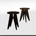 Wooden Round Stools with Three Legged Design Black Accents and Different Wood Tones