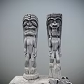 Traditional Wooden Totem Poles With Intricate Facial Carvings And Body Details