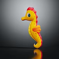 Yellow And Red Seahorse Toy With Orange Fins On Black Background