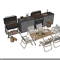Outdoor Kitchen Area Featuring Grills Wooden Table Chairs And Cooking Utensils