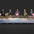 Ceremonial Launch Device Featuring Five People Decorative Flowers Wavy Pattern Tabletop and Wheels