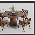 Stylish Wooden Round Dining Table Set With Four Chairs And Vase With Green Plants