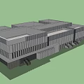 Modern Office Building Exterior With Glass Facade And Metal Panels Under Blue Sky