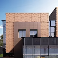 Modern Townhouse Exterior Design Featuring Glass Elements Geometric Structure And Greenery