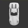 Sleek Silver Two Door Sports Car With Streamlined Body And Alloy Wheels