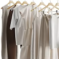 Light Colored Clothes Hanging On Rack Featuring Dresses Tops And Pants