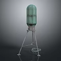 Green Cylindrical Equipment with Metal Tripod Base and Cable Nearby