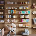 Baby Crib In Organized Nursery With Stroller Baby Clothes And Padded Seat