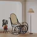 Rattan Leisure Chair with Blanket and Potted Plant Near Floor Lamp in Modern Interior