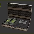 Open Hard Case With Foam Interior Containing Two Green Batteries White Device And Colored Wires