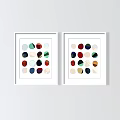 White Framed Abstract Paintings With Colorful Circular Shapes Displayed On Light Colored Wall