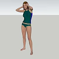 Woman in Green Swimsuit Standing on Green Grass with Hands on Head and Trees Around