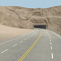 Scenic Desert Highway Leading To Tunnel Through Rocky Cliffs And Sand Dunes