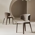 Modern Minimalist Dining Chairs With Curved Fabric Backrest And Slim Wooden Legs In Beige Interior