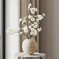 Beige Ceramic Vase with White Blossoms on Pedestal by Window Curtain and Mountain View