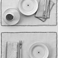 Stylish Dinnerware Set With Polka Dot Plates Brown Napkins Woven Placemats And Cutlery
