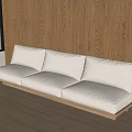 White Fabric Three Seater Sofa With Wooden Frame Against Wooden Wall And Window