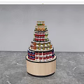 Modern Circular Multi Tiered Display Shelf With Wooden Base Displaying Canned Goods