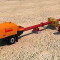 Industrial Equipment With Red Pump Yellow Connecting Components And Orange Trailer On Sandy Ground
