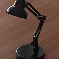Black Adjustable Desk Lamp with Flexible Arm Round Base on Wooden Tabletop