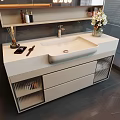 Modern White Washbasin Vanity Design With Vase Flowers Toiletries On Shelf And Glass Panel Drawers
