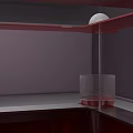 Red Square Table With Transparent Glass Top And Four White Spherical Decorations