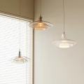 Modern Pendant Lights With Different Designs Hanging Near White Blinds And Light Walls