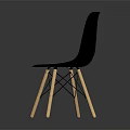 Black Leisure Chair With Wooden Crossed Legs Sleek Design And Reflective Floor