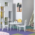 White Round Children's Table with Chairs Colorful Bookshelf and Abstract Painting on Purple Green Rug
