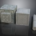Intricate Carved Stone Sculptures Featuring Cubes And Cylinder With Detailed Patterns