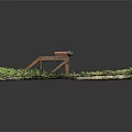 Rusty Metal Frame Equipment With Roller Standing Among Green Grass And Gravel
