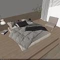Modern Wooden Double Bed with White Black Pillows Gray Blanket Light Chair Green Plant Lamp