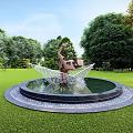 Human Sculpture with Raised Hands Wing Like Structure in Round Fountain Pool on Green Lawn