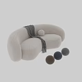 Curved Beige And Brown Sofa With Gray Throw Blanket And Round Pillow