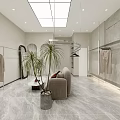 Modern Clothing Store Interior With Clothing Racks Sofa Seating Potted Plants And Marble Flooring